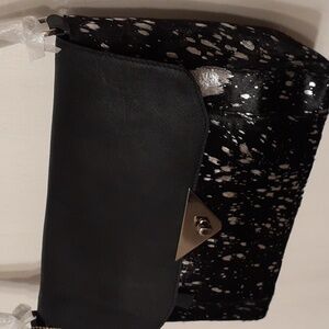 Black and silver leather handbag. ( Brand New )